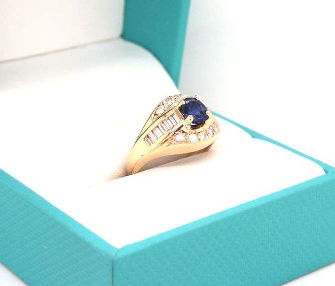 14kt Yellow gold 0.75ct sapphire with 0.50ctw diamond ring