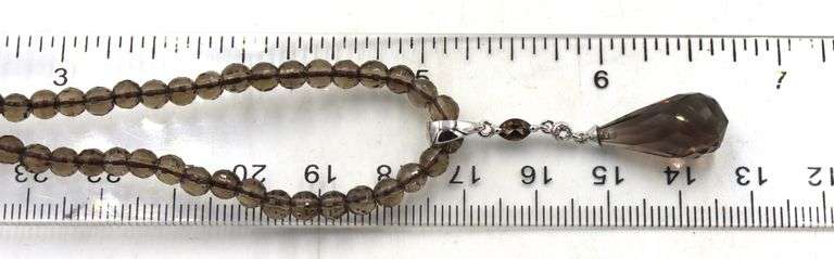 Pear shaped smokey quartz pendant on beaded necklace
