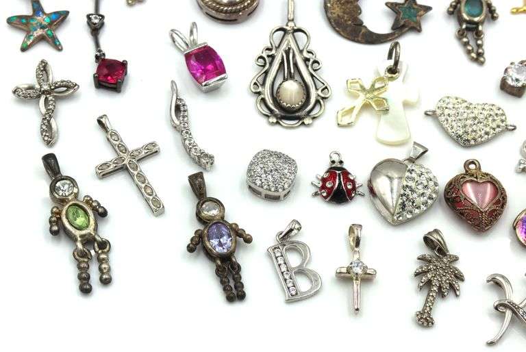 Lot of vintage 925 sterling silver pendants and charms