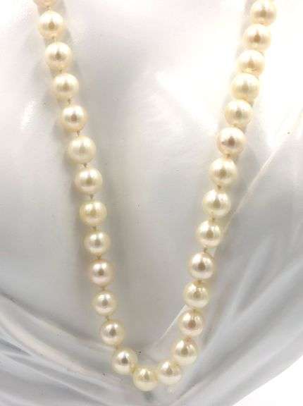 White fresh water pearl strand necklace with gold clasp