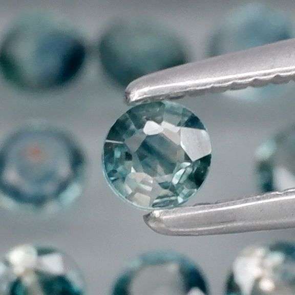 Heated only! 4.52ct blue green Sapphire set