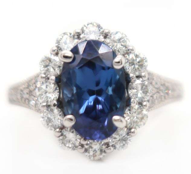 2.71ct Oval Tanzanite and 1.12ctw Diamond Frame Ring in 14K