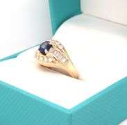 14kt Yellow gold 0.75ct sapphire with 0.50ctw diamond ring