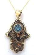 14kt Yellow gold Vintage Hamsa pendant with blue stone