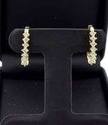 14kt Yellow gold 0.70ctw 4 prong diamond J hoop earrings