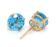 One pair of 14kt yellow gold round blue topaz stud earrings