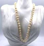 White fresh water pearl strand necklace with gold clasp