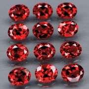 Lovely 5.37ct oval cut cherry red Garnet set