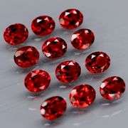 Lovely 5.51ct oval cut cherry red Garnet set