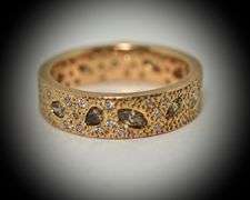 Unique 18K Rose Gold Band with Numerous Diamonds