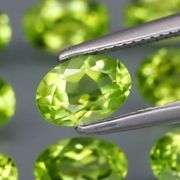 Fantastic 4.99ct 6x4mm oval cut Peridot set
