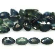 Heated only! 7.90ct blue green Sapphire set