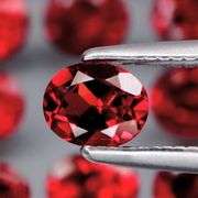 Lovely 5.37ct oval cut cherry red Garnet set