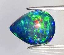 Outstanding 4.16ct full body flashing Black Opal