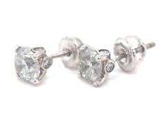 One pair of 14kt white gold round brilliant cut diamond stud earrings