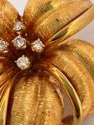 14K YELLOW GOLD AND DIAMOND FLOWER DESIGNED BROOCH
