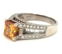 14kt White gold Yellow orange diamond in 1.75ctw white diamond setting