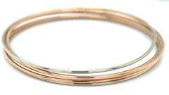18kt White and yellow gold set of 5 bangles