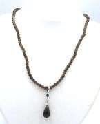 Pear shaped smokey quartz pendant on beaded necklace