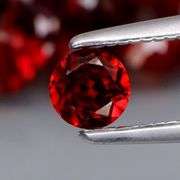 Fiery color!! Heavy 10.26ct Mozambique Garnet set!
