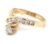 14kt Yellow gold 0.50ctw channel set twisted shank engagement ring
