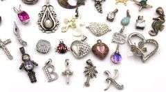 Lot of vintage 925 sterling silver pendants and charms