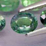 Awesome 4.66ct oval cut GREEN Sapphire set