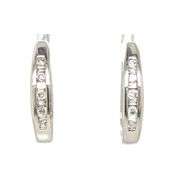 14kt White gold 0.15ctw baguette diamond J hoop earrings