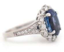 2.71ct Oval Tanzanite and 1.12ctw Diamond Frame Ring in 14K