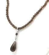 Pear shaped smokey quartz pendant on beaded necklace