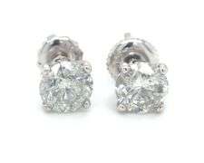 One pair of 14kt white gold round brilliant cut diamond stud earrings