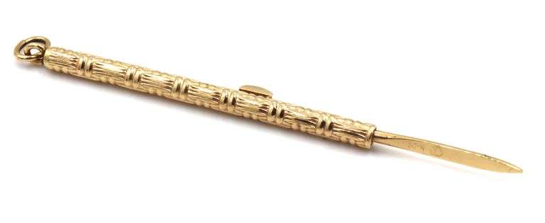 Useful and Unusal 14K YG Retractable Toothpick