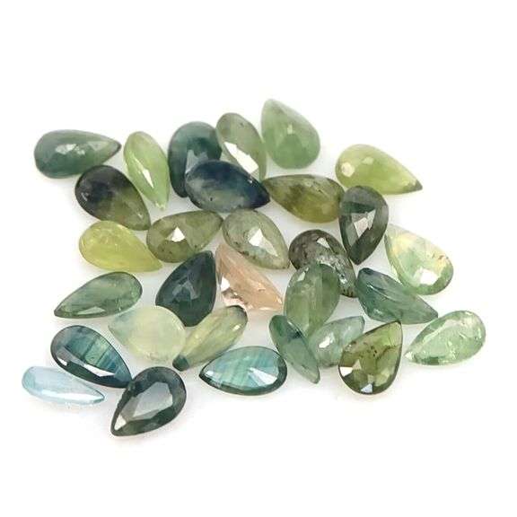 Multi-hue 7.38ct natural blue green Sapphire set