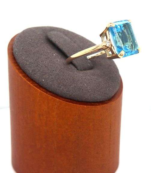 14kt Yellow gold 8ctw Emerald cut blue topaz and diamond accent ring