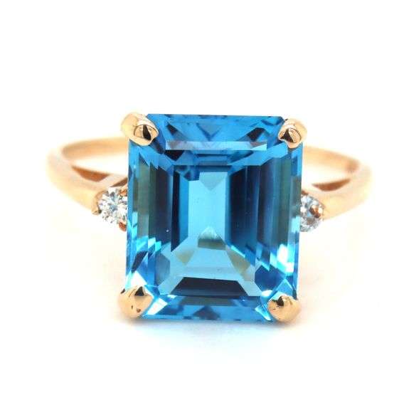 14kt Yellow gold 8ctw Emerald cut blue topaz and diamond accent ring