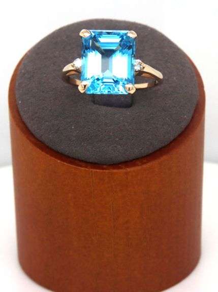 14kt Yellow gold 8ctw Emerald cut blue topaz and diamond accent ring