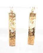 14kt Yellow gold diamond cut oval hoops