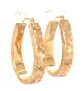 14kt Yellow gold diamond cut oval hoops