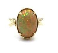 14kt Yellow gold oval opal Crisscross ring
