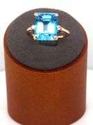 14kt Yellow gold 8ctw Emerald cut blue topaz and diamond accent ring