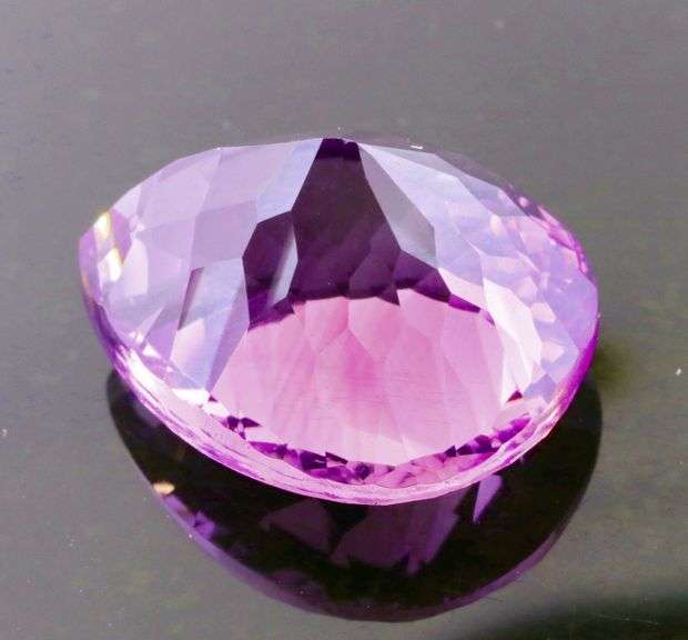 Concave flashing 18.76c bright violet Amethyst