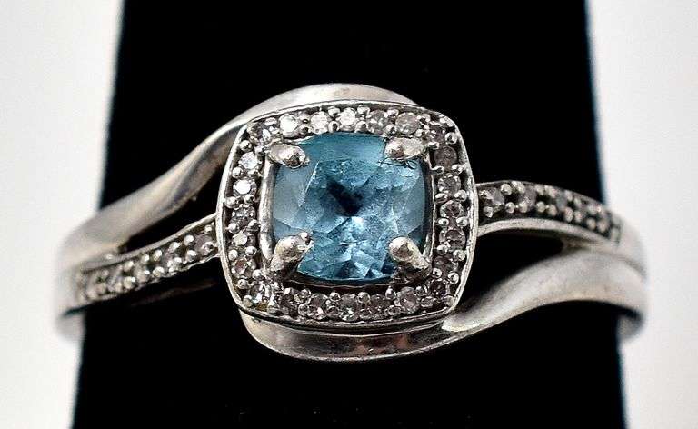 Blue Topaz Halo Ring in Sterling Silver