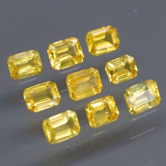 Incredible 2.25ct emerald cut yellow Sapphire set -Heated only!