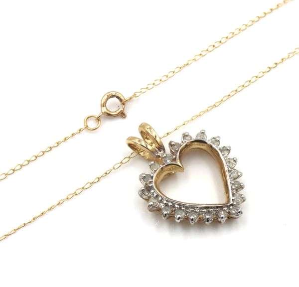 10kt Yellow gold diamond heart shaped pendant on chain