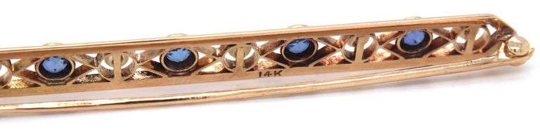 Antique Enamel, blue sapphire and pearl brooch in 14kt yellow gold