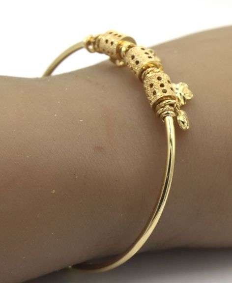 18kt Yellow gold charm bangle bracelet