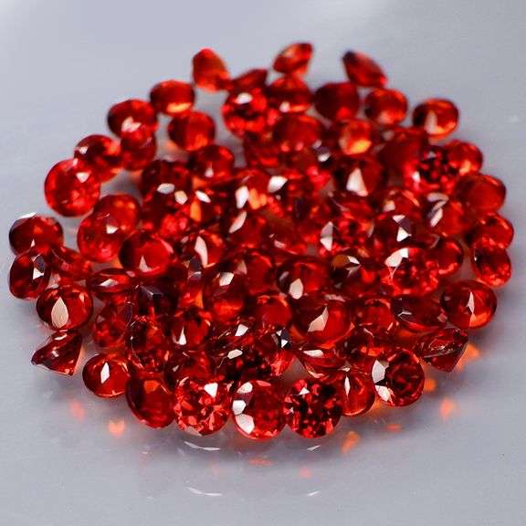 Outstanding 6.16ct diamond cut high fire Mozambique Garnet set