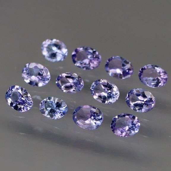Heavy flashing 2ct oval cut Tanzanite set