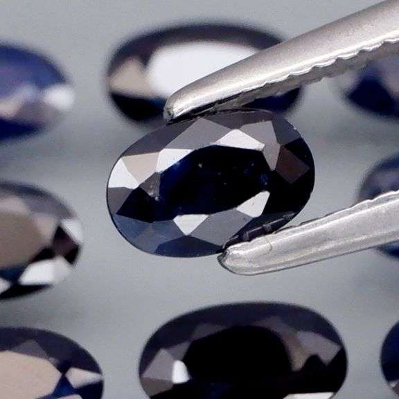 Beautifully colored 3.30ct ink blue Sapphire set
