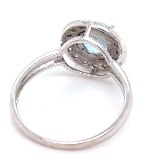 14kt White gold blue topaz and diamond ring